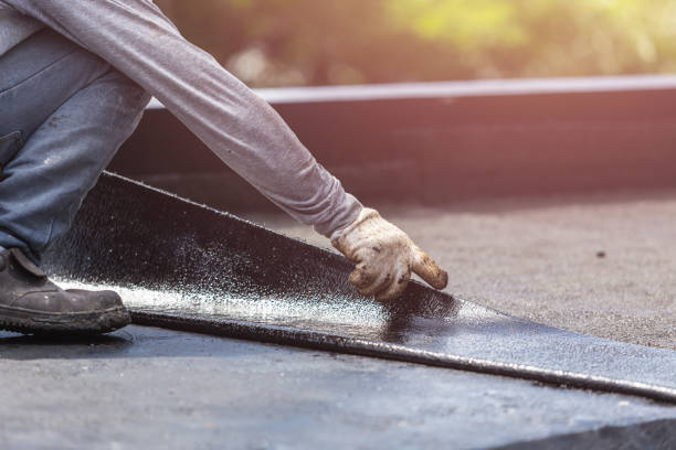 Professional Basement Waterproofing technician working in Rochester, NY